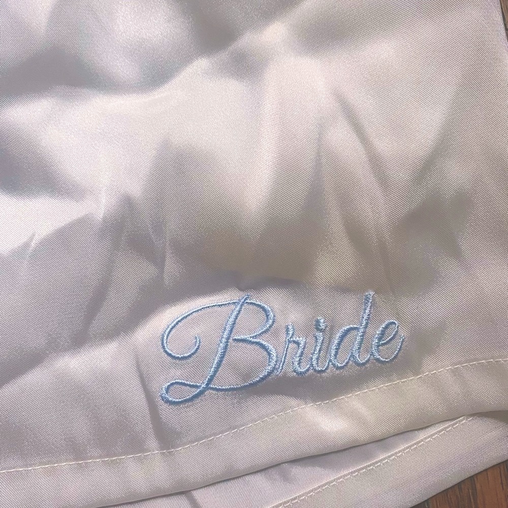 In Bloom By Jonquil ivory with blue embroidered “BRIDE” shorts. Size Med NWT